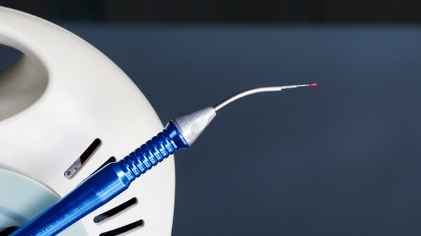 Closeup of patient mouth receiving dental cleaning