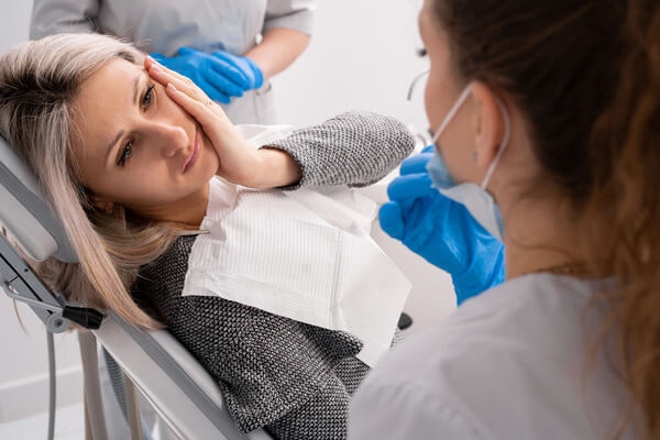 Closeup of patient mouth receiving dental cleaning